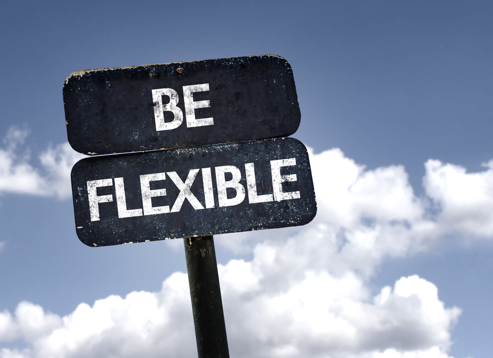 Be Flexible sign with clouds and sky background-1