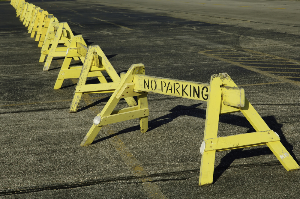 Row of No Parking barriers across parking lot